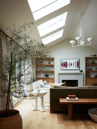a living room with skylights overhead