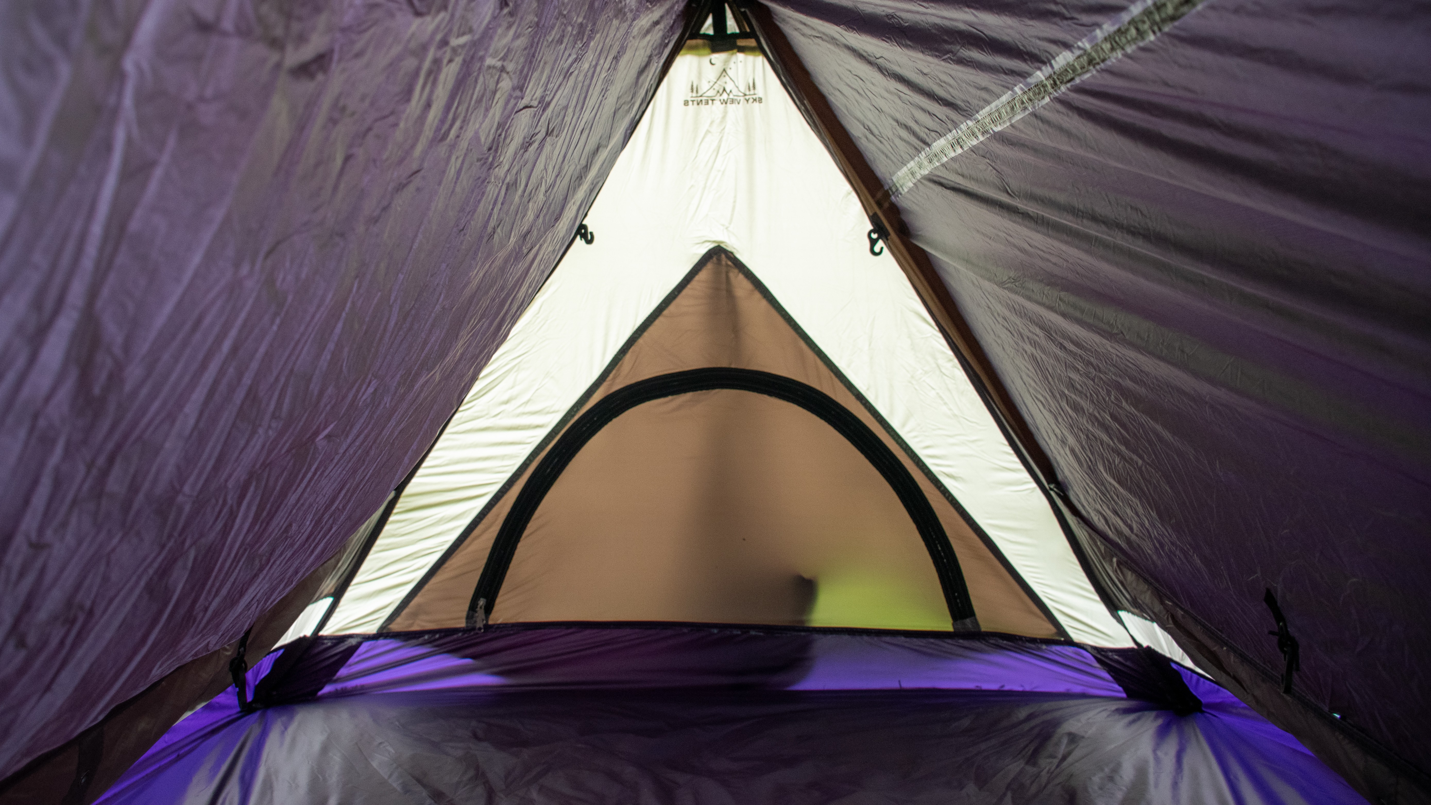 Nylon tent material is seen inside a tent.