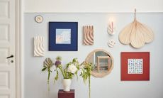 gallery wall with frames, mirrors and objects