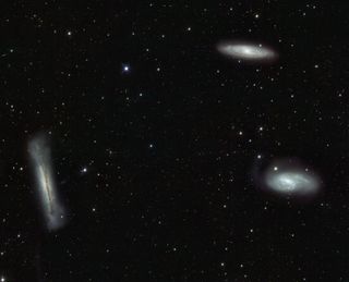 The famous Leo Triplet of spiral galaxies is located below the star Chertan in Leo. This image from the VLT Survey Telescope in Chile covers about 1 degree, or two full moon diameters, and will fit into an amateur telescope's field of view at low magnification. The three galaxies, each in a different orientation, are about 30 million light-years away.