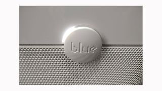Image shows a closeup of the power button on the Blue Pure 211+