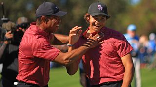 Tiger Woods and Charlie Woods celebrate the hole in one at the PNC Championship