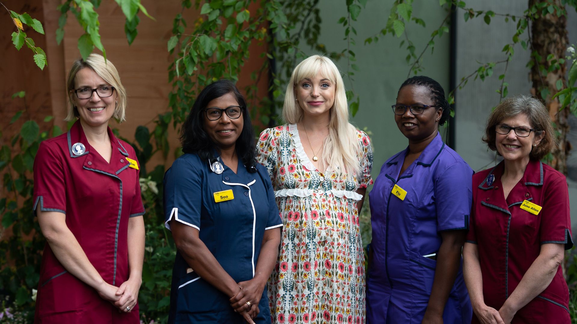 Helen George with a group of Nightingale nurses in the Florence Nightingale Garden, 2021
