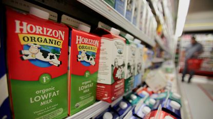 Cartons of milk are seen on a store shelf in New York.