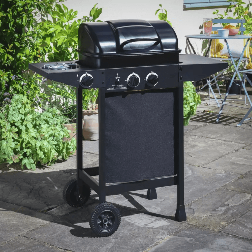 The Argos Home 2 Burner BBQ in a garden