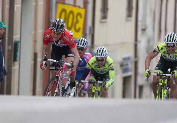 Riders crest the hill in sight of the finish line in Bonorva.