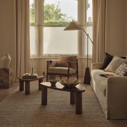 A neutral living room decorated with pieces from the M&S spring/summer 2026 range, including the Ribbed Arc Floor Lamp