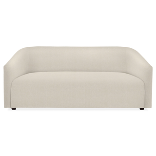 curved white single-cushion sofa