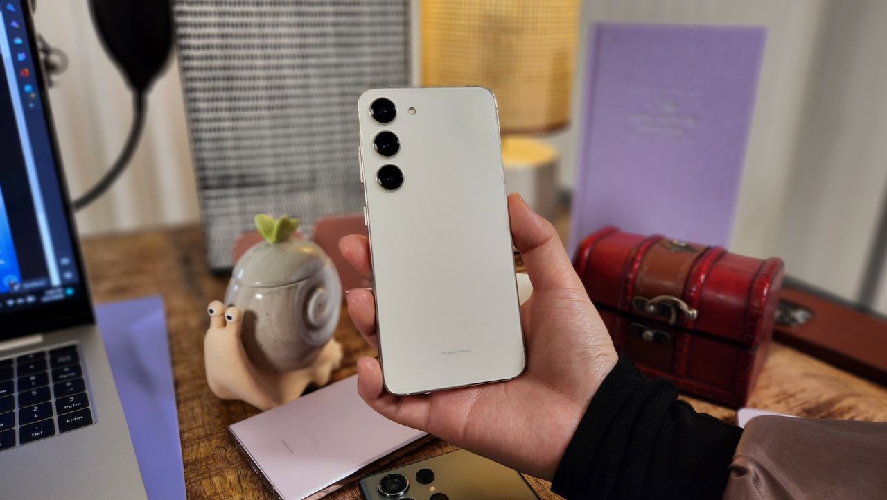 The Cream Samsung Galaxy S23 held in hand