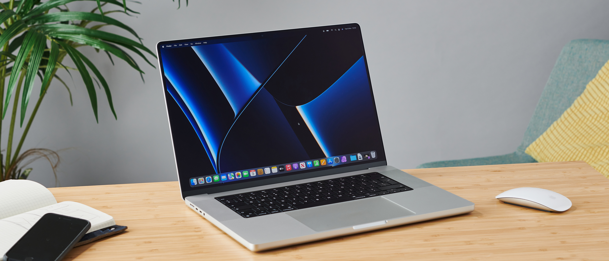 MacBook Pro 16 inch on wooden table in modern office