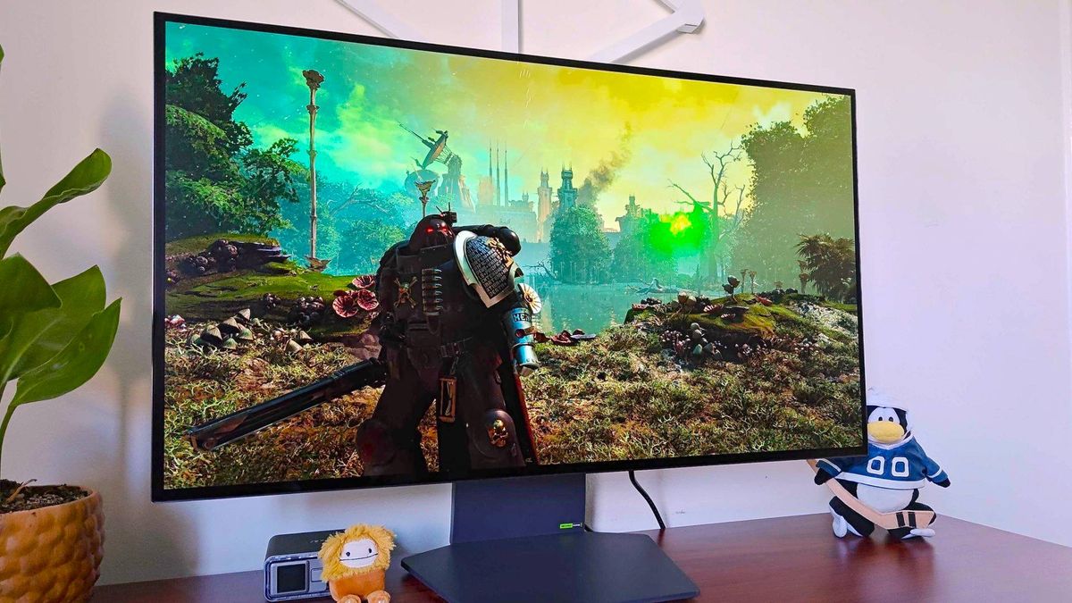 LG Ultragear 32GS95UE-B monitor with Space Marines 2 gameplay on screen