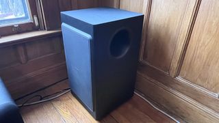 Nakamichi Dragon subwoofer in corner of room