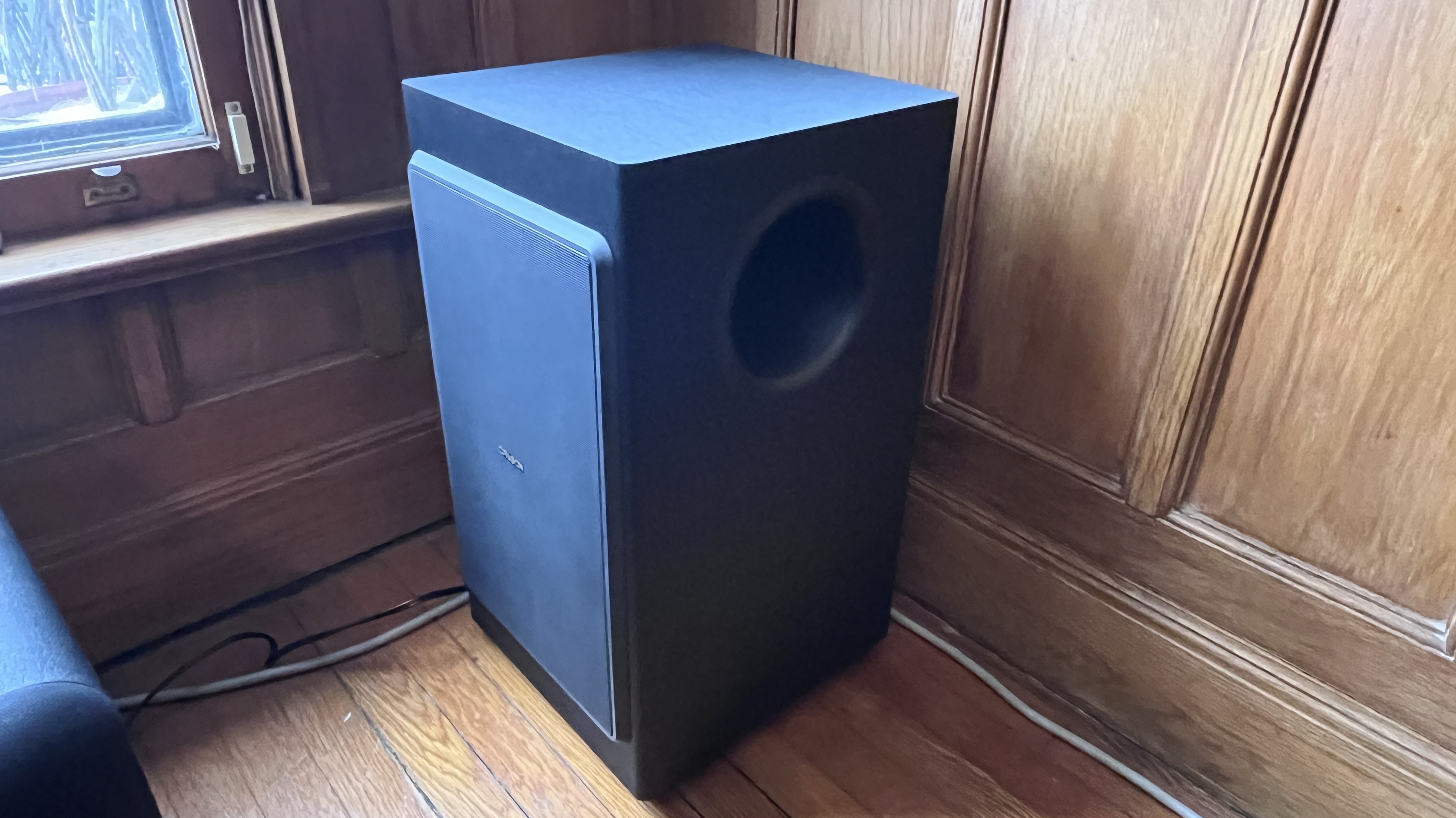 Nakamichi Dragon subwoofer in corner of room