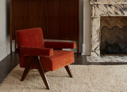 A rust-colored living room chair