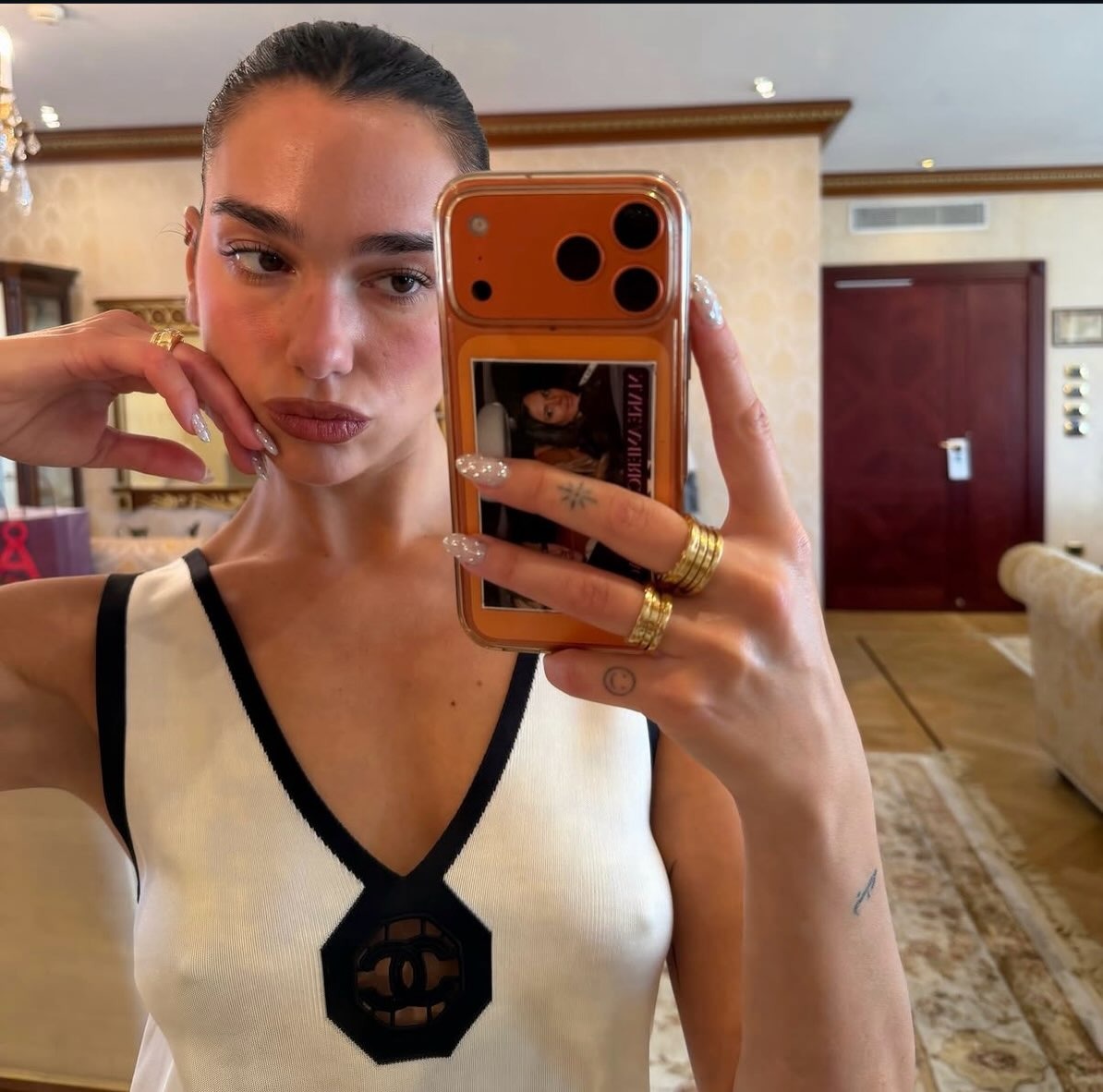 Dua Lipa with silver bedazzled nail art