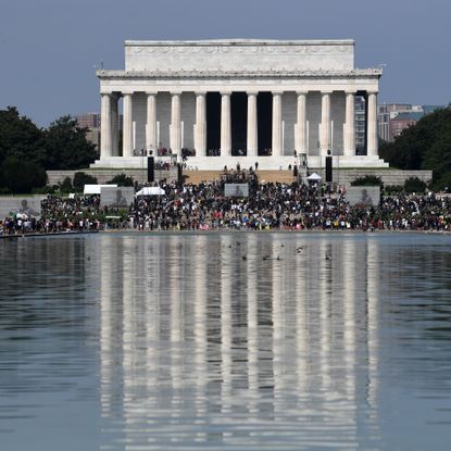 demonstrators walk to the lincoln memorial for the commitment march get your knee off our necks protest against racism and police brutality, on august 28, 2020, in washington dc anti racism protesters marched on the streets of the us capital on friday, after a white officers shooting of african american jacob blake the protester also marked the 57th anniversary of civil rights leader martin luther kings historic i have a dream speech delivered at the lincoln memorial photo by eric baradat afp photo by eric baradatafp via getty images