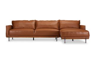 A tan leather chaise sectional sofa