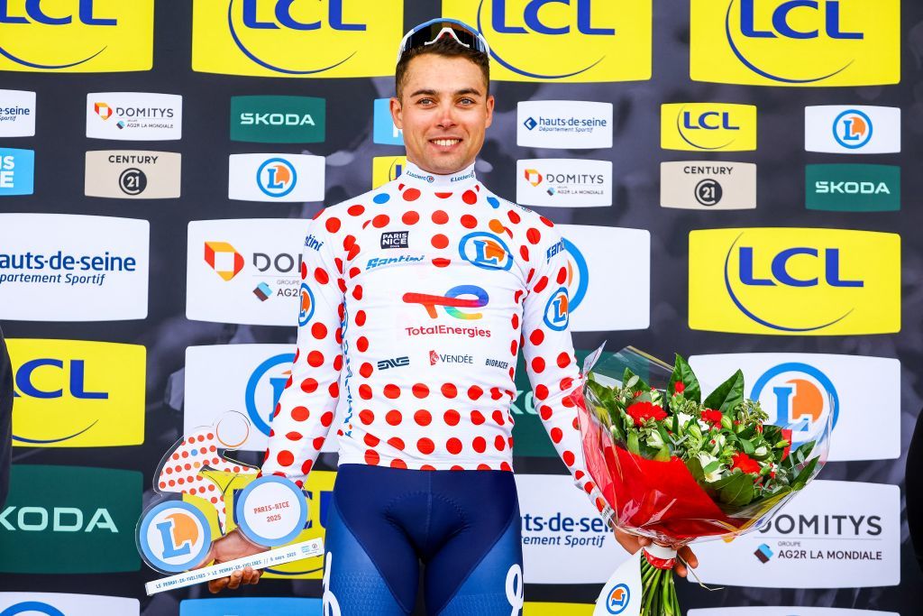 French Alexandre Delettre of TotalEnergies celebrates on the podium in the red polka-dot jersey for best climber after the first stage of 83th edition of the Paris-Nice cycling race, from and to Le Perray-en-Yvelines (156,5km), Sunday 09 March 2025. BELGA PHOTO DAVID PINTENS (Photo by DAVID PINTENS / BELGA MAG / Belga via AFP)
