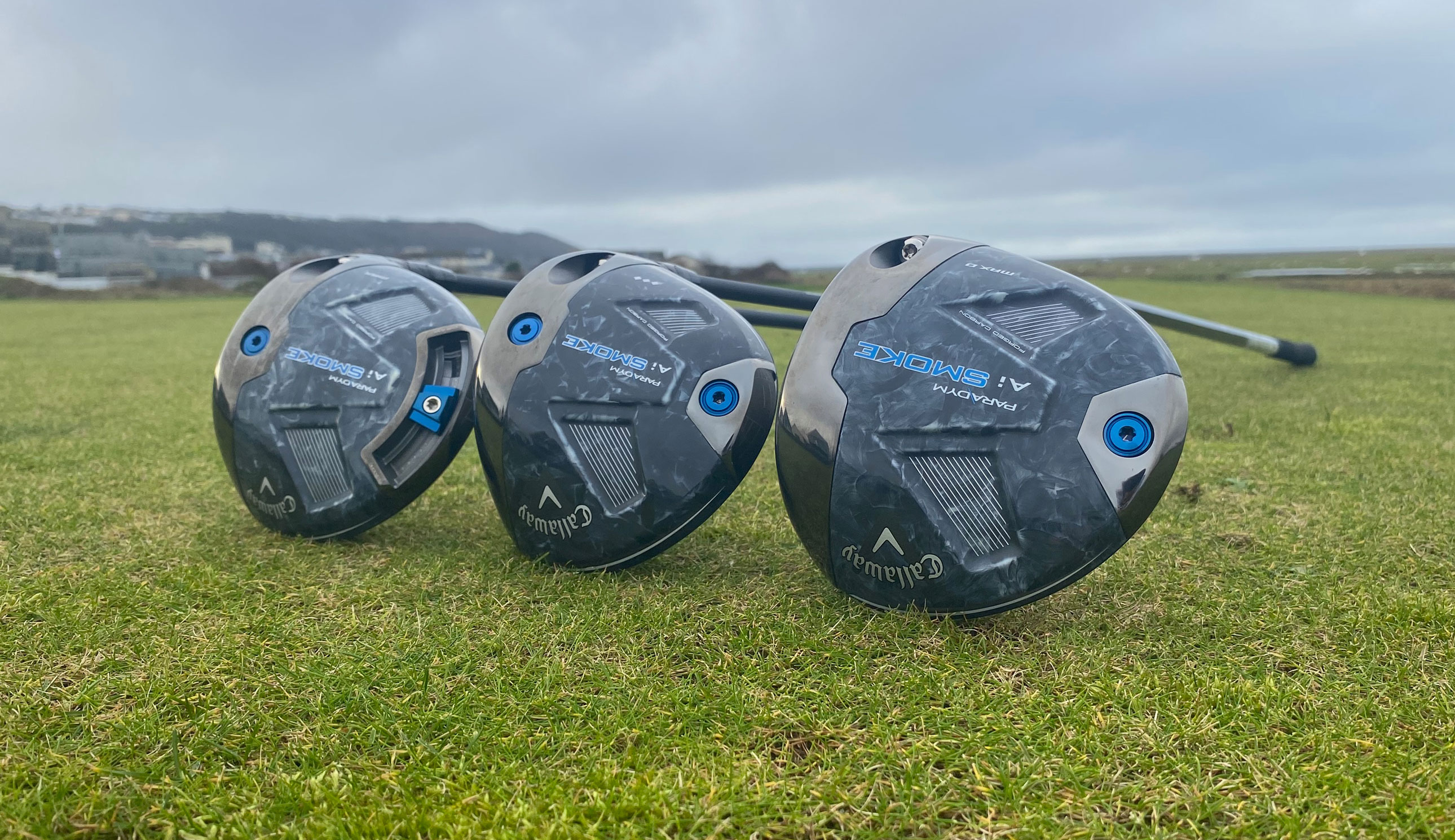 Three Callaway Paradym Ai Smoke drivers on the ground