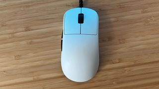 Endgame Gear OP1 8K gaming mouse sitting straight on a wooden desk