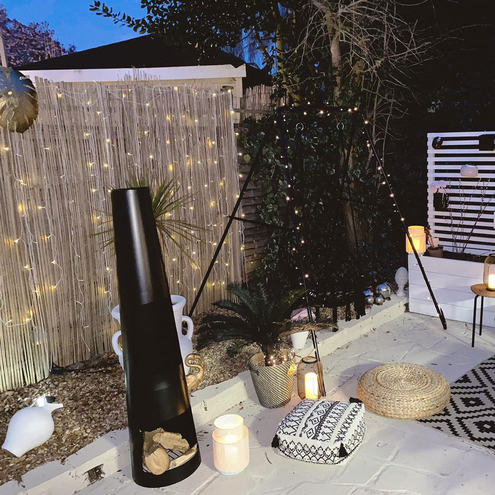 patio area with white floor and potted plants