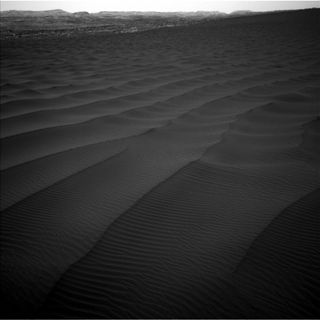 Ripples of sand stretch across the Martian landscape in this image from the Navcam on the Mars Curiosity rover, taken on Feb. 6, 2017.