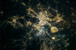 Canadian Space Agency astronaut Chris Hadfield posted this view of Hangzhou, China, from space at night on Feb. 9, 2013, to mark the start of Chinese New Year on Feb. 10.