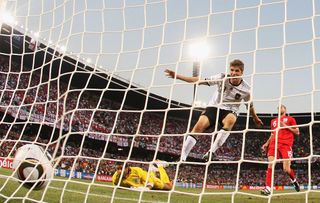 Thomas Mueller of Germany celebrates scoring his teams fourth past goal David James of England during the 2010 FIFA World Cup South Africa Round of Sixteen match between Germany and England at Free State Stadium on June 27, 2010 in Bloemfontein, South Africa.