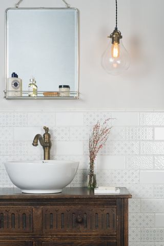 Small patterned tiles in a bright bathroom