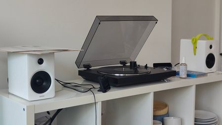 The Sony PS-LX310BT and Edifier M90 on a shelf.
