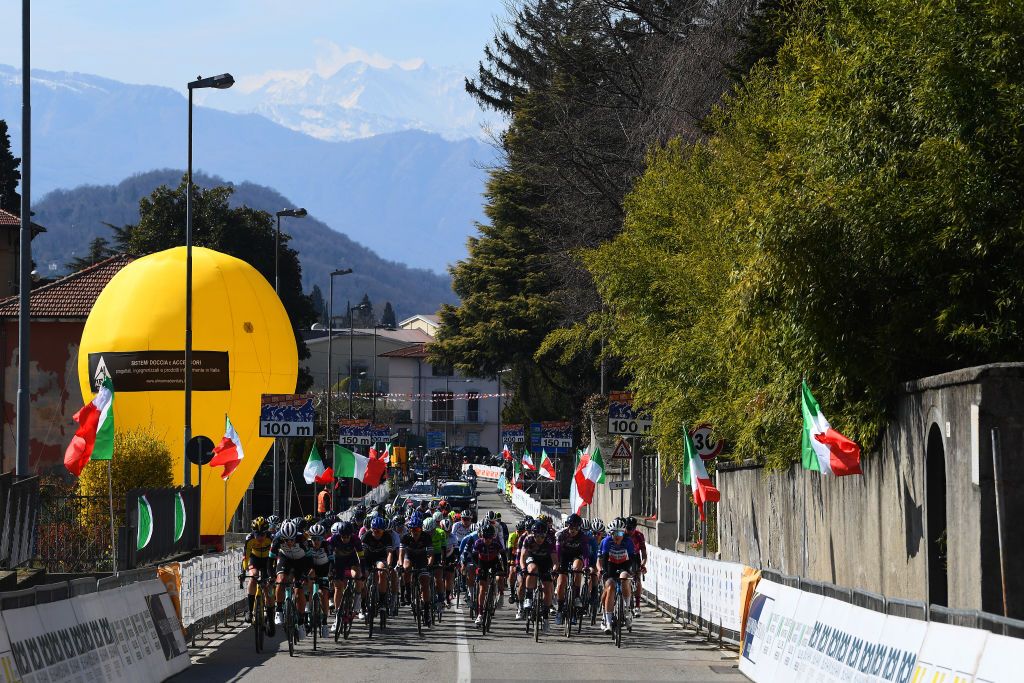 CITTIGLIO ITALY MARCH 21 The peloton crosses Cittiglio village during the 45th Trofeo Alfredo BindaComune di Cittiglio 2021 Womens Elite a 1418km stage from Cocquio Trevisago to Cittiglio 257m Arrival Village Mountains Snow Landscape Public Fans TrBinda UCIWWT on March 21 2021 in Cittiglio Italy Photo by Tim de WaeleGetty Images
