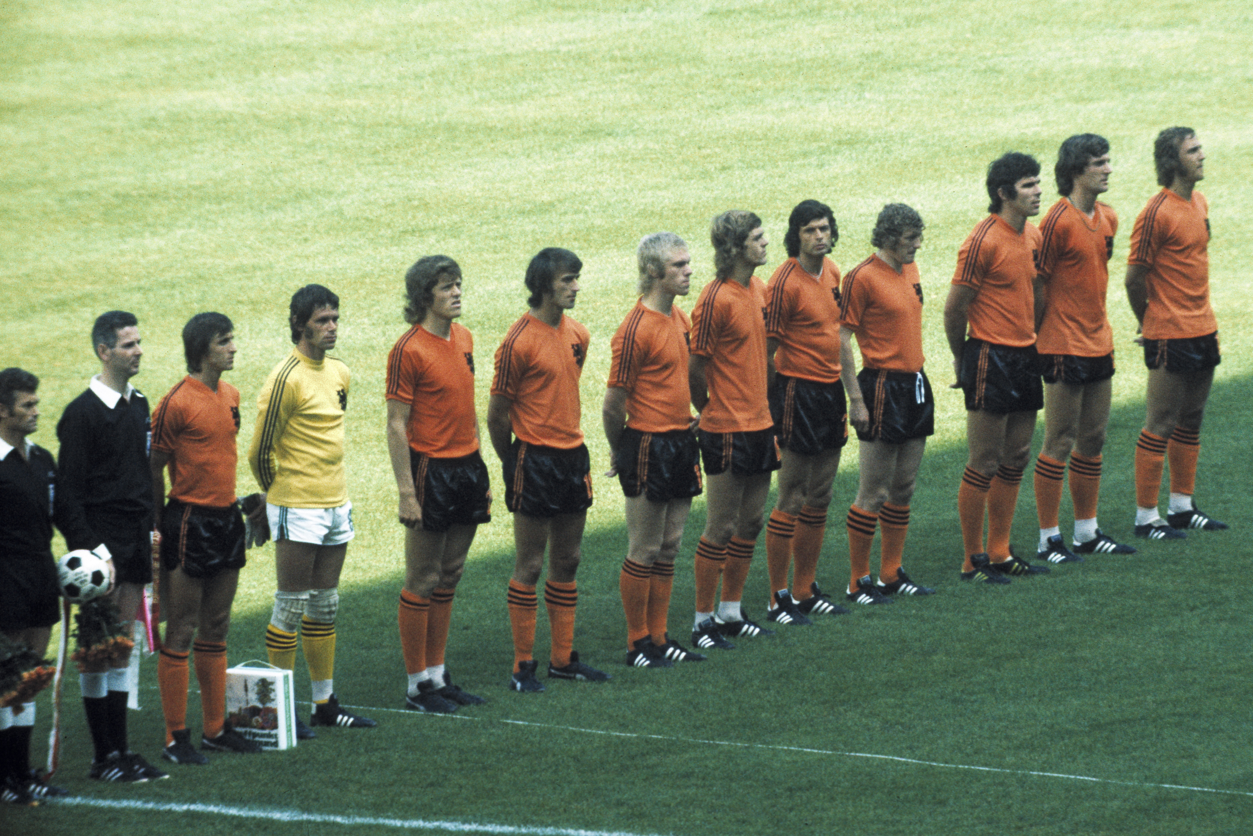 Johan Cruyff and the Netherlands team line up before a game at the 1974 World Cup.