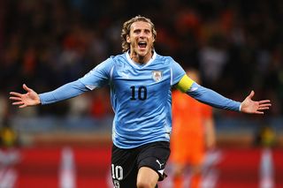 Diego Forlan of Uruguay celebrates scoring the equalising goal during the 2010 FIFA World Cup South Africa Semi Final match between Uruguay and the Netherlands at Green Point Stadium on July 6, 2010 in Cape Town, South Africa.
