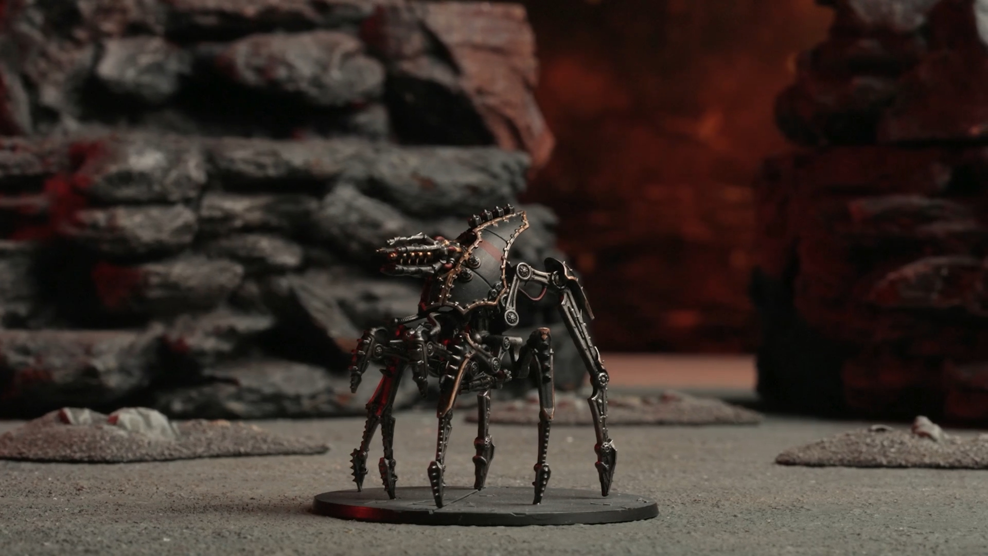 A Dark Mechanicum walker on a dusty battleground