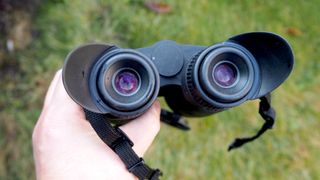 Pulsar Merger LRF XP35 binoculars on a grassy surface