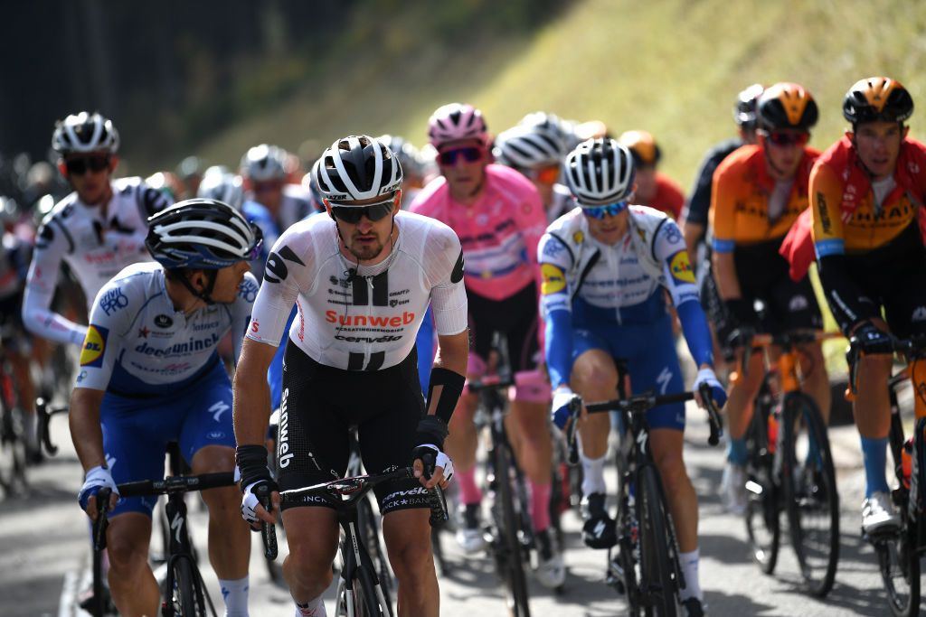 LAGHI DI CANCANO ITALY OCTOBER 22 Davide Ballerini of Italy and Team Deceuninck QuickStep Nico Denz of Germany and Team Sunweb Joao Almeida of Portugal and Team Deceuninck QuickStep Pink Leader Jersey during the 103rd Giro dItalia 2020 Stage 18 a 207km stage from Pinzolo to Laghi di Cancano Parco Nazionale dello Stelvio 1945m girodiitalia Giro on October 22 2020 in Laghi di Cancano Italy Photo by Tim de WaeleGetty Images