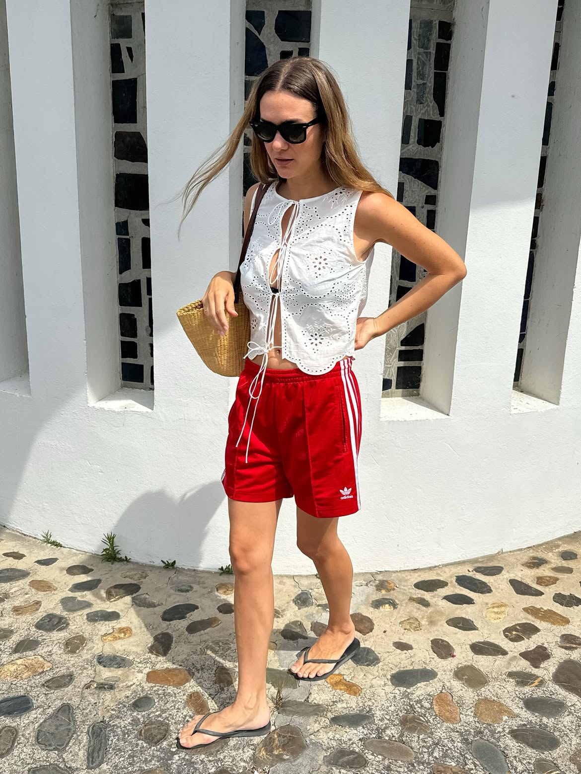 pretty white eyelet top with jeans and shorts outfit