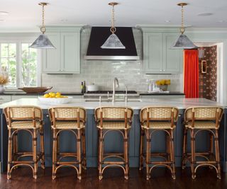 A dark blue and light green kitchen