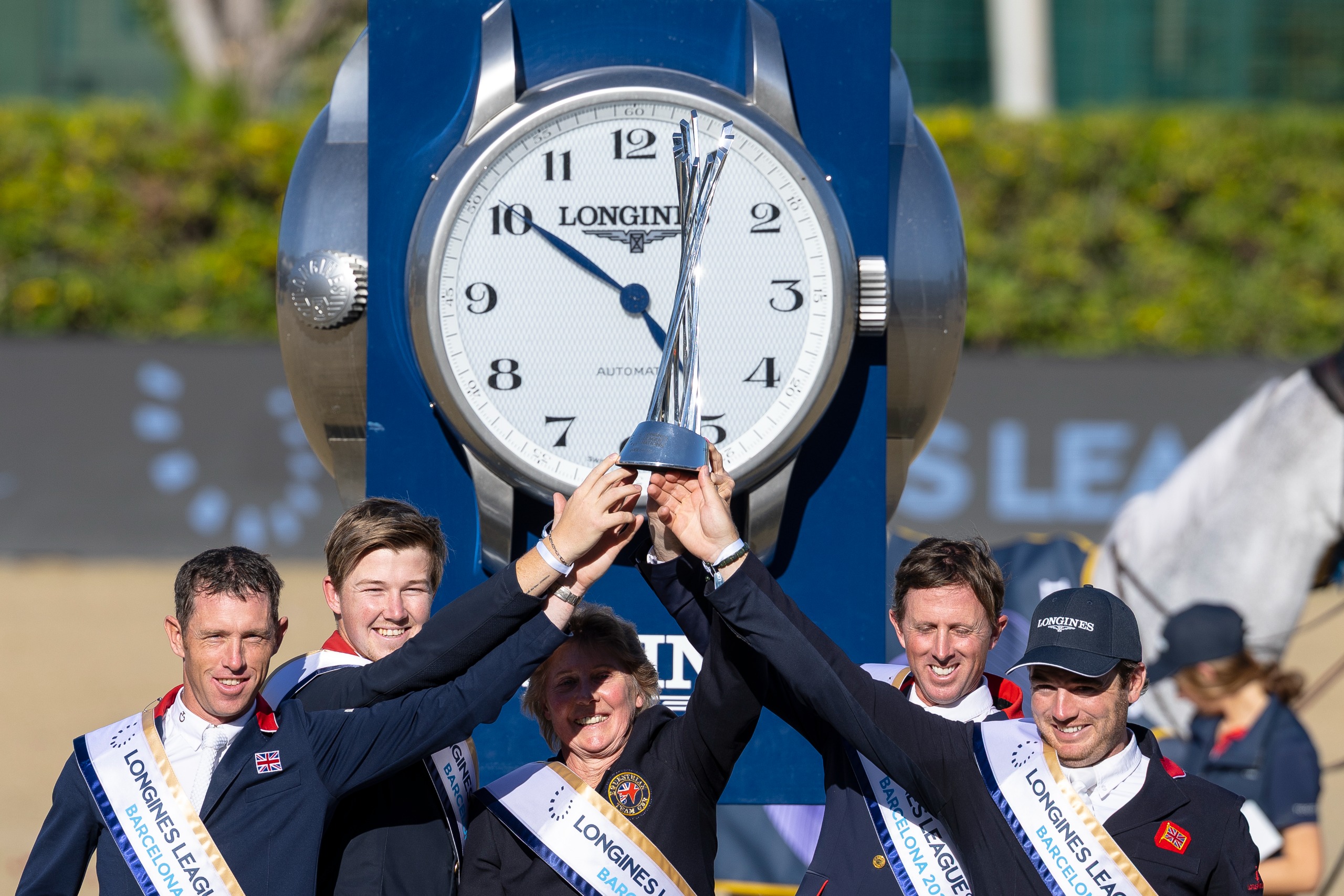 The winning British showjumping team at the 2025 LLN Final Barcelona of Scott Brash, Harry Charles, chef d'equipe Di Lampard, Ben Maher and Donald Whitaker lift the trophy