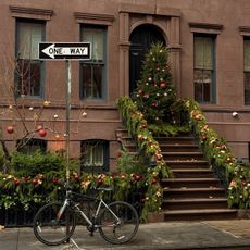 Brownstone with Christmas tree and holiday decorations.