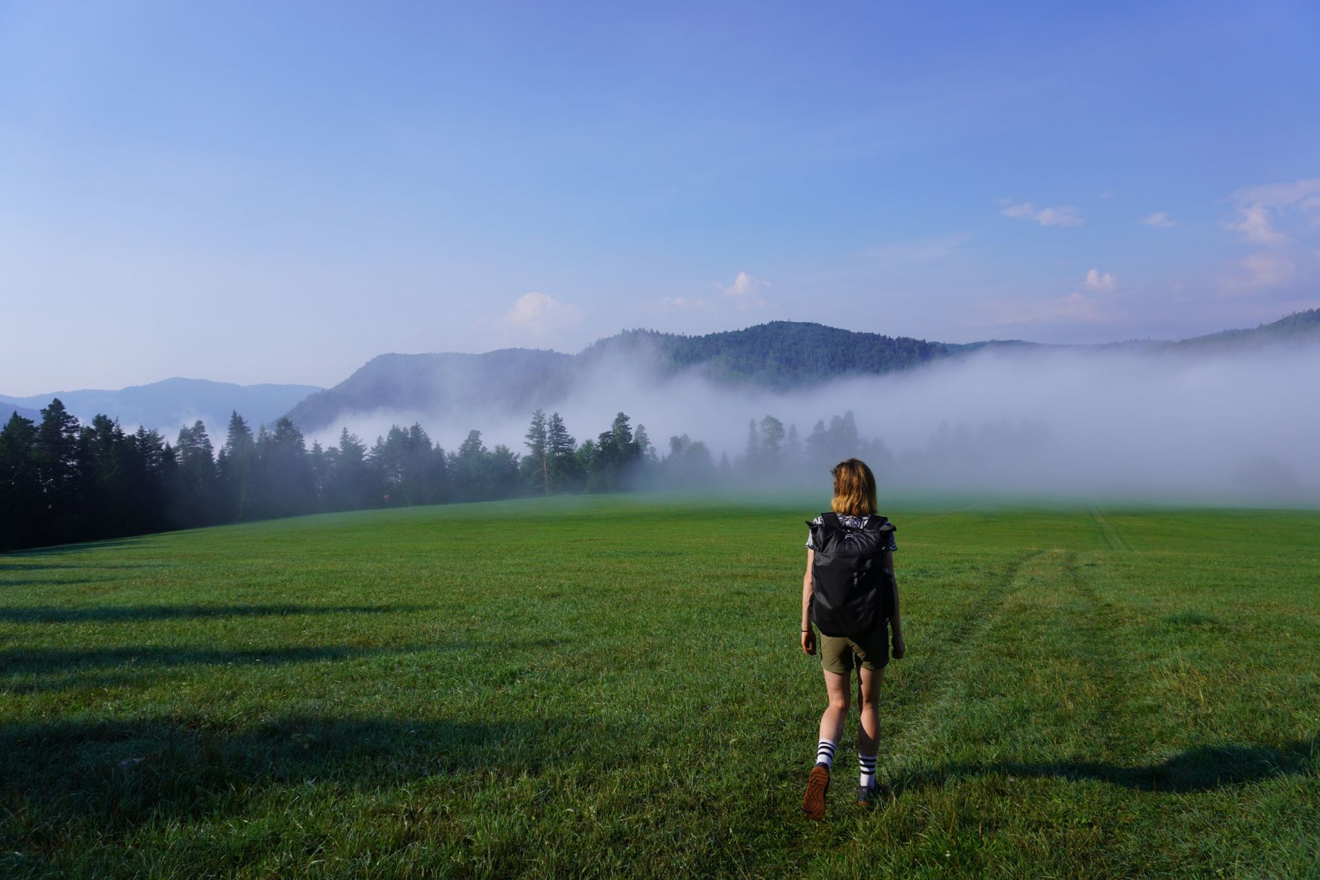 Image shows Anna walking in the Crankbrothers Stamp Lace flat shoes while on a gravel bikepacking trip.