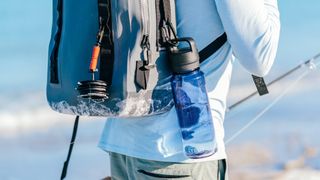 Yeti Yonder bottle attached to backpack