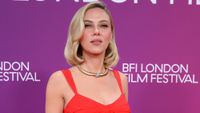 Scarlett Johansson in gold jewelry and a custom Prada gown in London October 2026. 