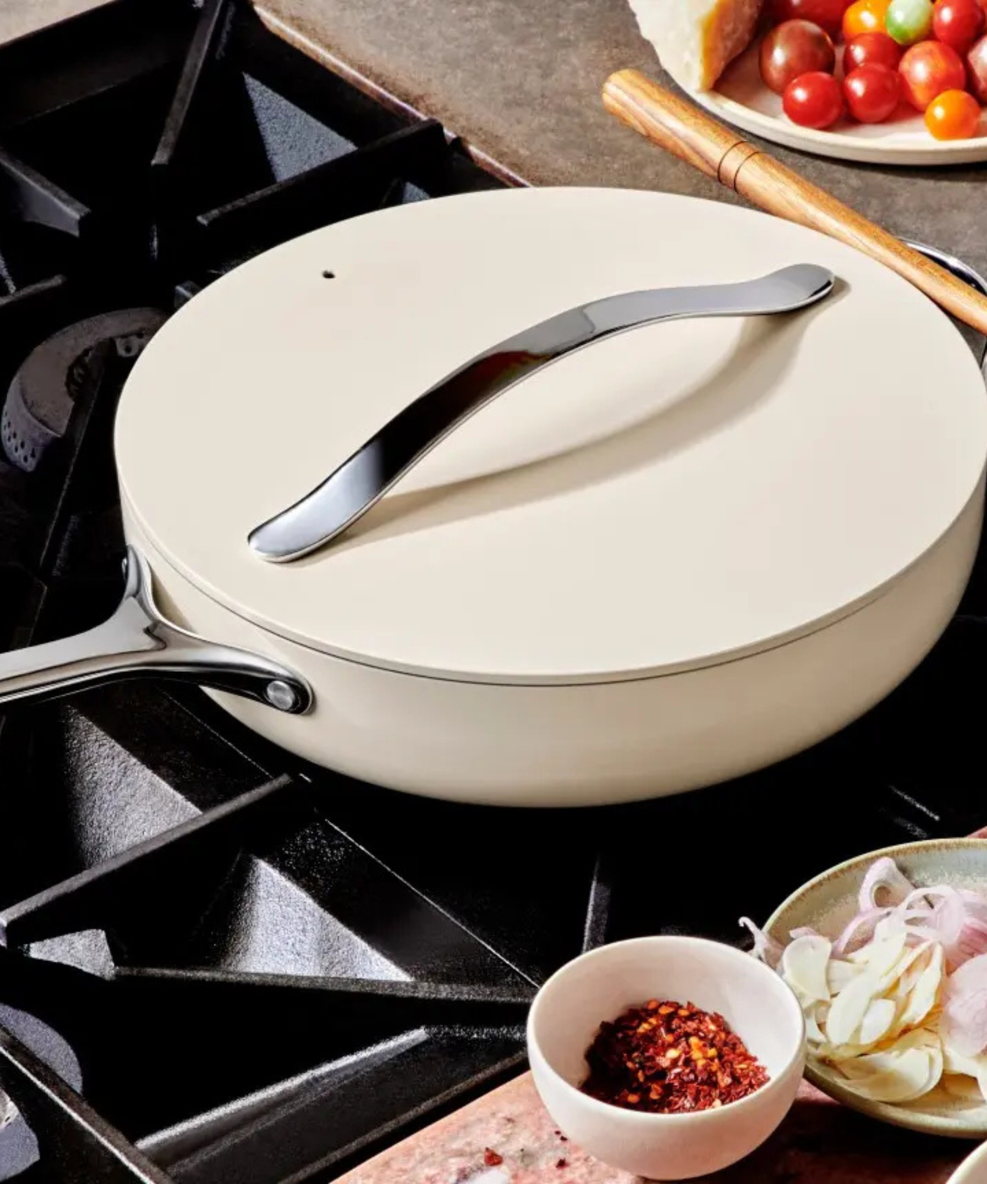 Caraway Ceramic Non-stick pan and lid on a gas stove