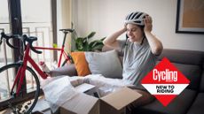 New cyclist tries on helmet with new bike in the background