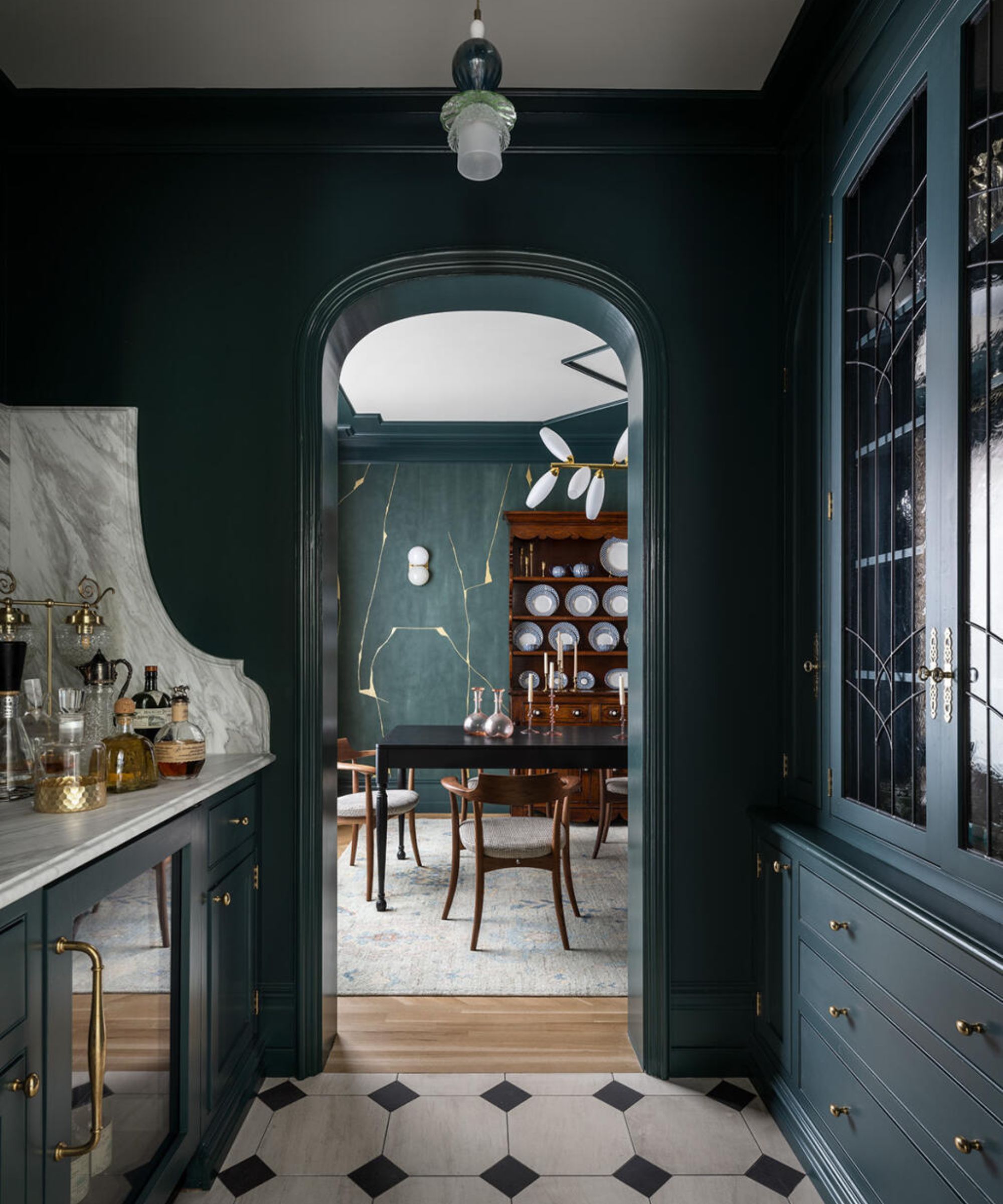 A dark green bar with a marble sidesplash