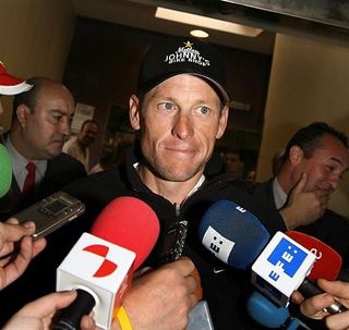 Lance Armstrong speaks to reporters
