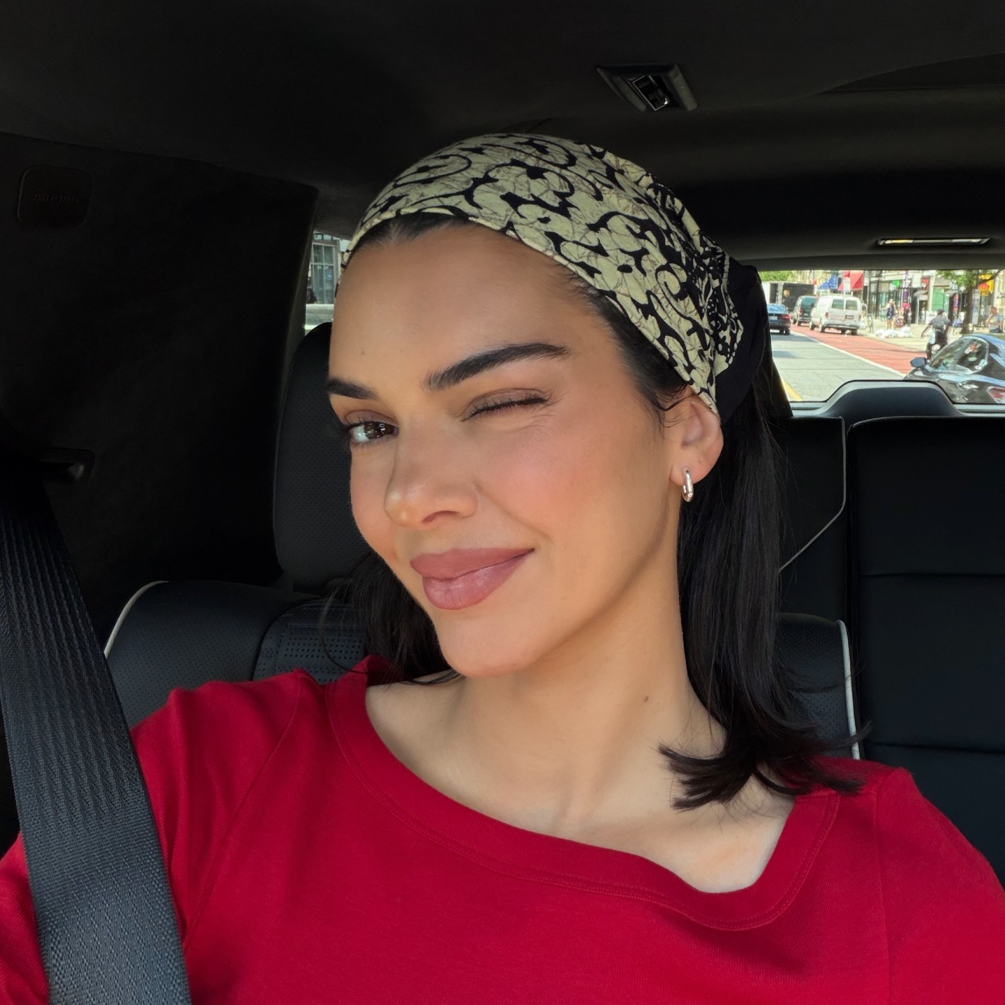 Photo of Kendall Jenner winking in a car selfie