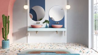 A colorful bathroom with pink sinks