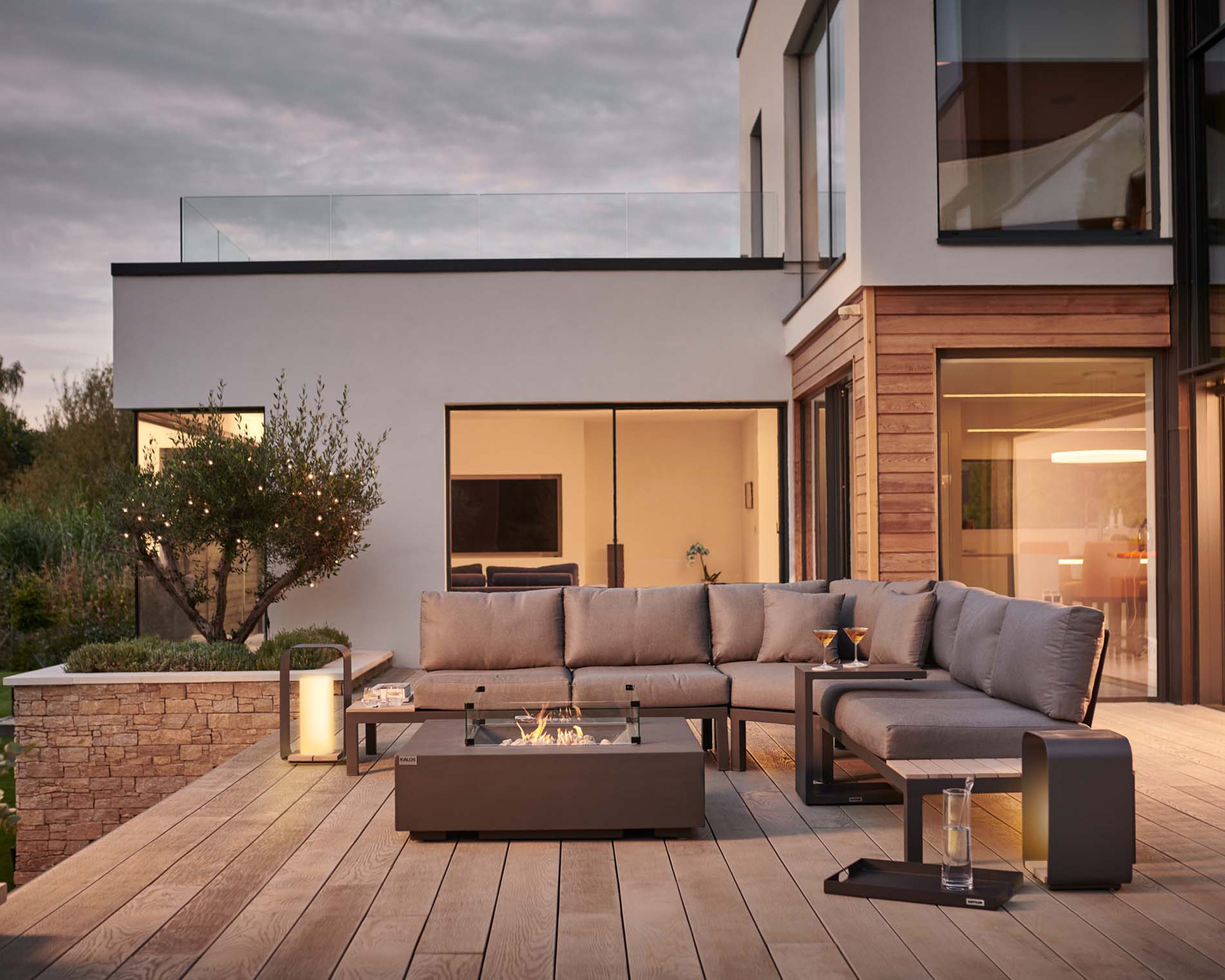 modern outdoor corner sofa set on a decked terrace